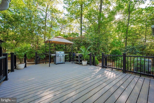 deck featuring a gazebo and area for grilling