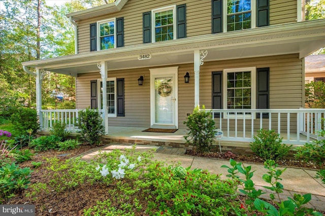 doorway to property with a porch