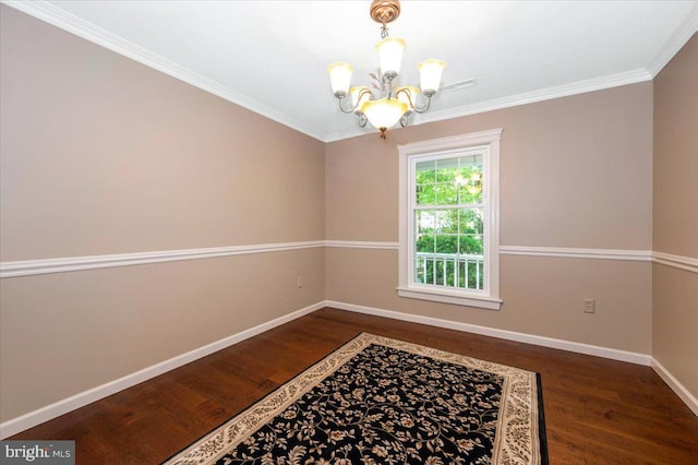 interior space featuring baseboards, dark wood finished floors, ornamental molding, and an inviting chandelier