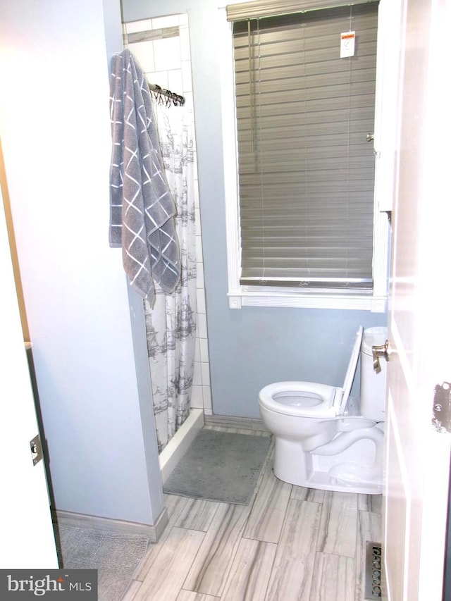 8807 Fearne Ave, Baltimore, MD 21234 - bathroom with a shower with curtain and toilet