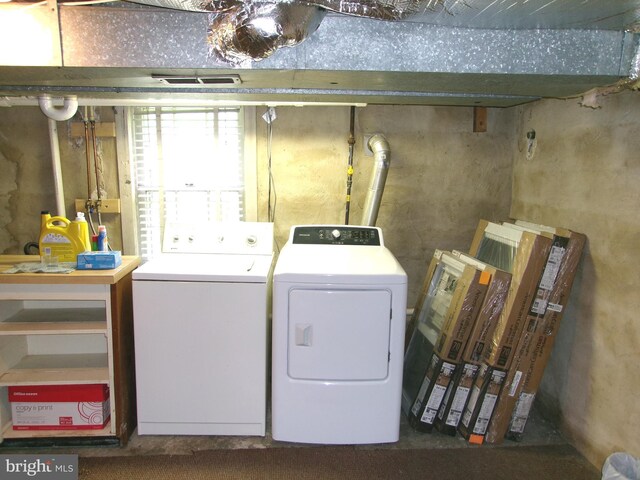 8807 Fearne Ave, Baltimore, MD 21234 - washroom featuring laundry area, visible vents, washer and clothes dryer, and water heater