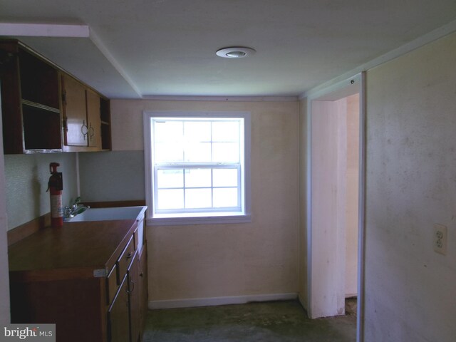 8807 Fearne Ave, Baltimore, MD 21234 - kitchen with baseboards and a sink
