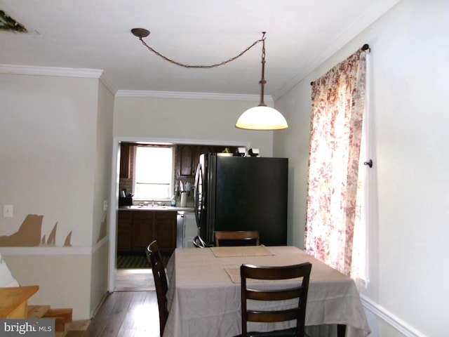8807 Fearne Ave, Baltimore, MD 21234 - dining space with crown molding and light wood finished floors