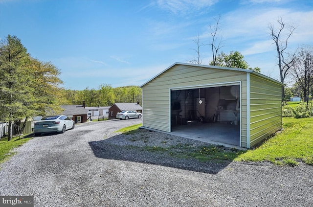 detached garage featuring driveway
