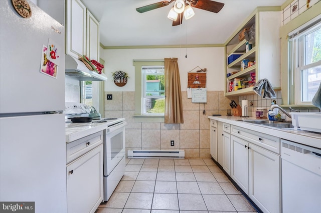 kitchen with white appliances, tile walls, ceiling fan, light countertops, and a baseboard heating unit