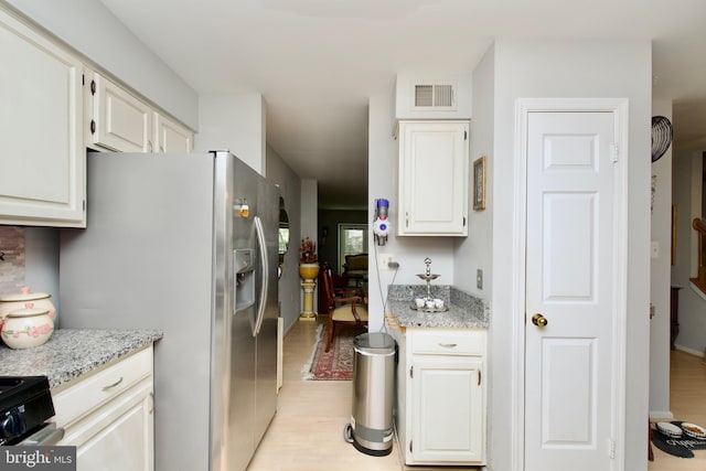 4024 Nicholas Ct, Fairfax, VA 22033 - kitchen with stainless steel appliances, light wood-style floors, light stone countertops, and white cabinets