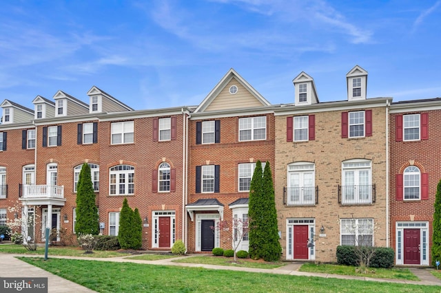 20920 Houseman Ter, Ashburn, VA 20148 - view of property featuring brick siding and a front yard