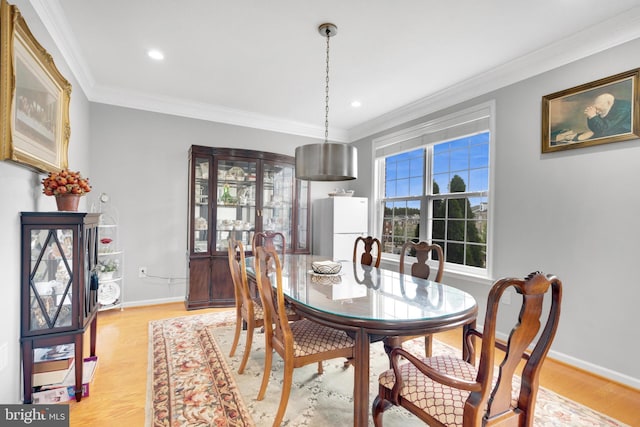 20920 Houseman Ter, Ashburn, VA 20148 - dining space featuring baseboards, ornamental molding, and light wood finished floors