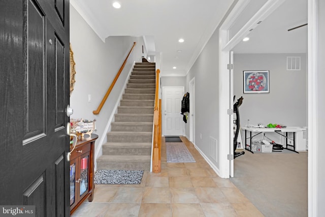 20920 Houseman Ter, Ashburn, VA 20148 - foyer entrance with visible vents, recessed lighting, stairs, and crown molding