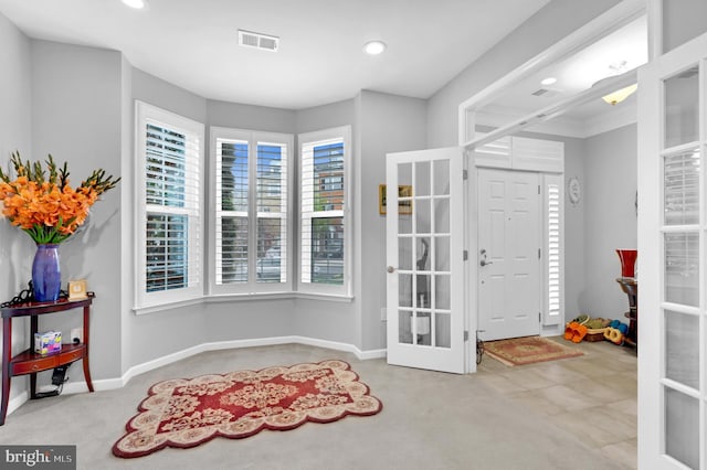 20920 Houseman Ter, Ashburn, VA 20148 - carpeted foyer featuring recessed lighting, baseboards, visible vents, and french doors