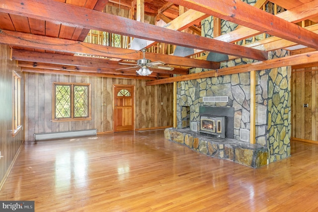 unfurnished living room featuring a ceiling fan, beamed ceiling, wood finished floors, and a baseboard radiator
