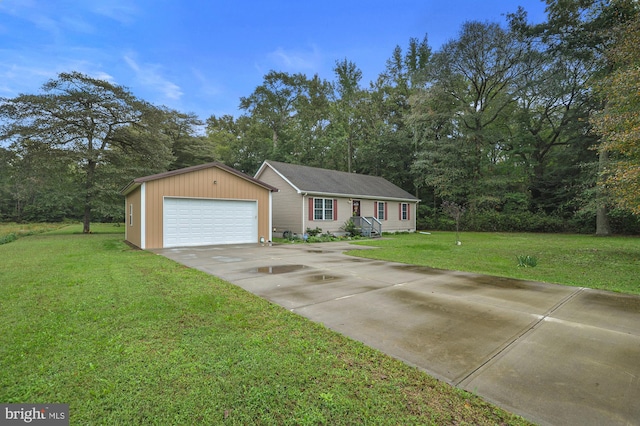 ranch-style home featuring a garage, an outbuilding, and a front yard