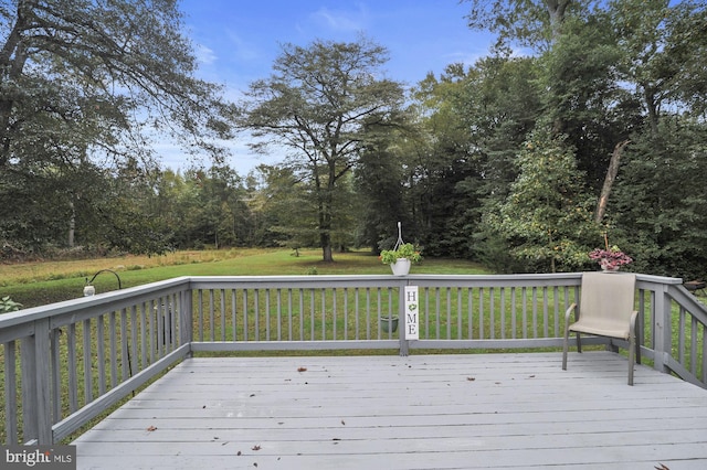 wooden deck with a yard