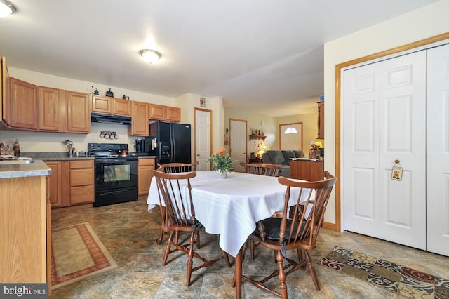 dining room featuring stone finish floor