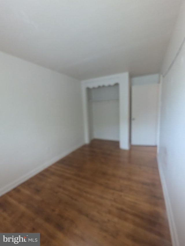 2407 S 12th St, Camden, NJ 08104 - unfurnished bedroom featuring baseboards and wood finished floors