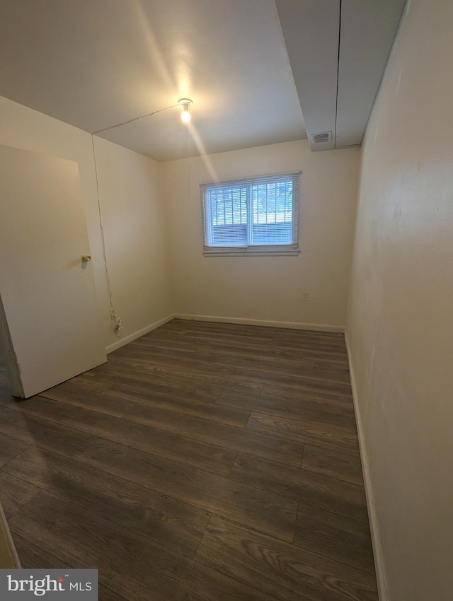 2407 S 12th St, Camden, NJ 08104 - spare room featuring visible vents, dark wood-style flooring, and baseboards