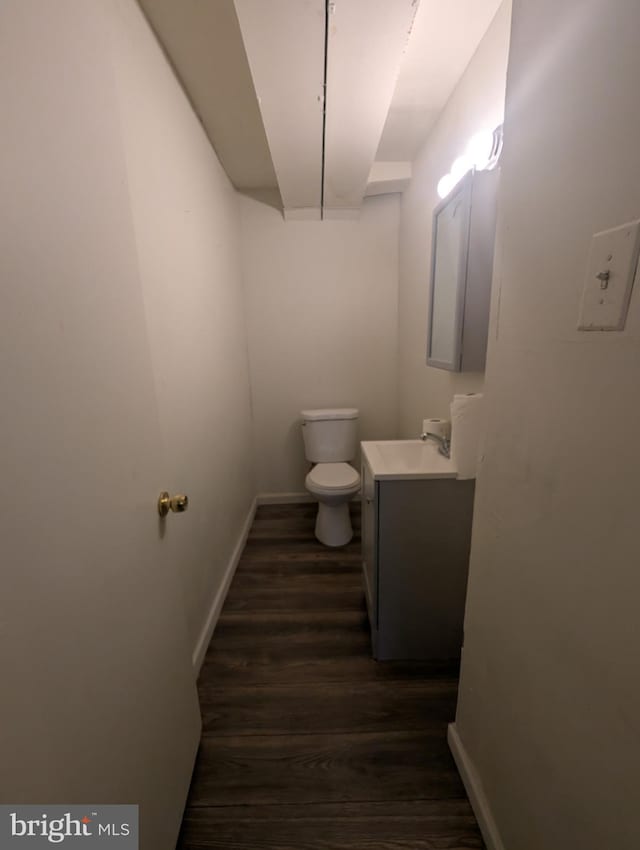 2407 S 12th St, Camden, NJ 08104 - half bath featuring toilet, baseboards, wood finished floors, and vanity
