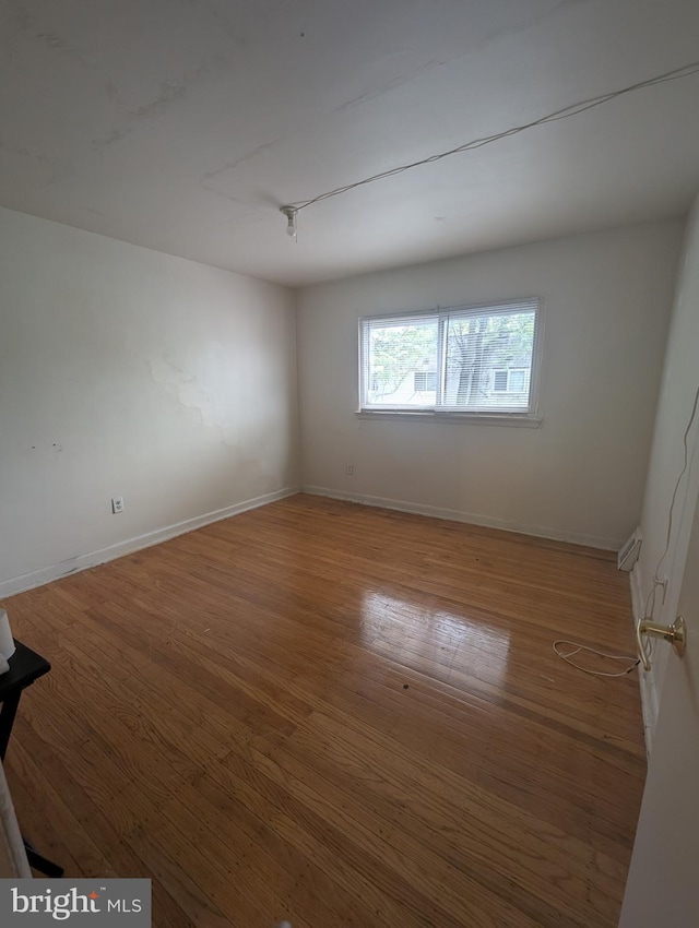 2407 S 12th St, Camden, NJ 08104 - spare room featuring baseboards and wood finished floors