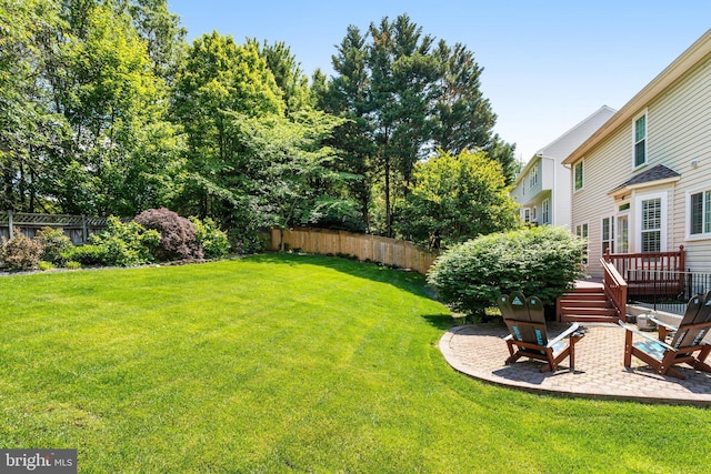 5811 Valley Vw, Alexandria, VA 22310 - view of yard featuring a wooden deck and a patio area