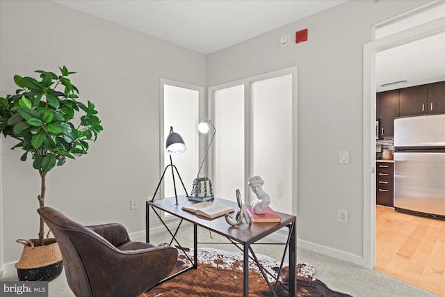 office area featuring baseboards and visible vents