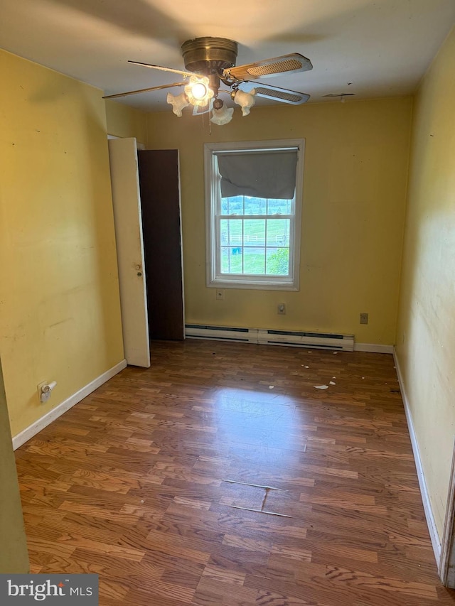 8600 Gue Rd, Damascus, MD 20872 - spare room featuring a ceiling fan, baseboards, wood finished floors, and a baseboard radiator