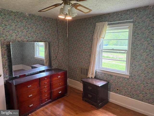 8600 Gue Rd, Damascus, MD 20872 - bedroom with baseboards, ceiling fan, light wood-type flooring, and a textured ceiling