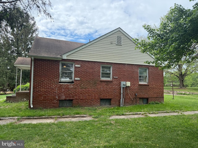 8600 Gue Rd, Damascus, MD 20872 - view of home's exterior with a shingled roof, brick siding, and a lawn
