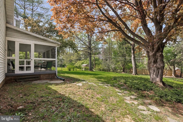 view of yard with a sunroom