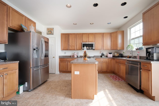 57 Pebble Creek Dr, Smyrna, DE 19977 - kitchen with appliances with stainless steel finishes, a sink, a center island, and recessed lighting