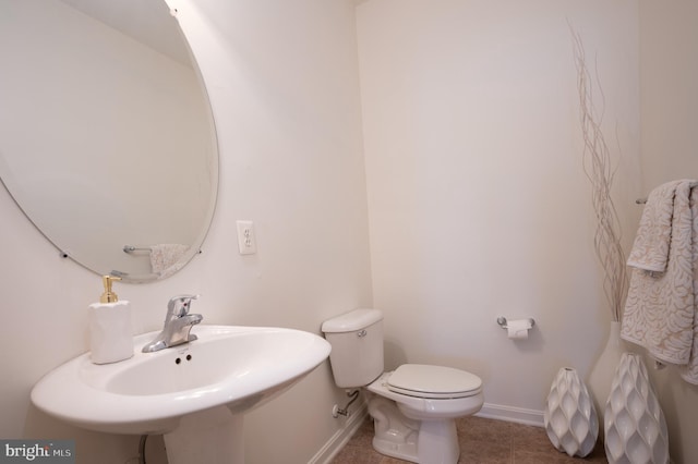 57 Pebble Creek Dr, Smyrna, DE 19977 - half bath with baseboards, toilet, and a sink