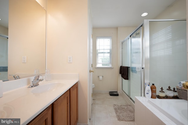 57 Pebble Creek Dr, Smyrna, DE 19977 - bathroom with tile patterned floors, double vanity, toilet, a bath, and a stall shower