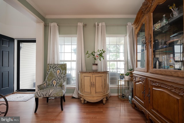 57 Pebble Creek Dr, Smyrna, DE 19977 - living area featuring healthy amount of natural light, wood finished floors, crown molding, and baseboards