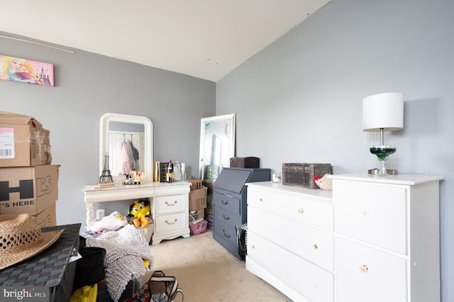 57 Pebble Creek Dr, Smyrna, DE 19977 - bedroom featuring vaulted ceiling and light carpet