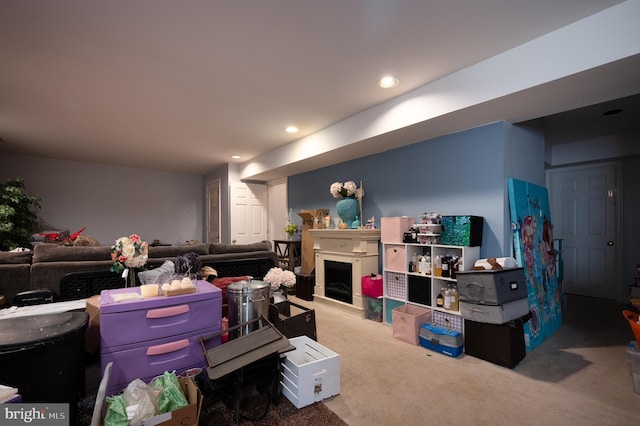 57 Pebble Creek Dr, Smyrna, DE 19977 - carpeted living area featuring recessed lighting and a fireplace with raised hearth