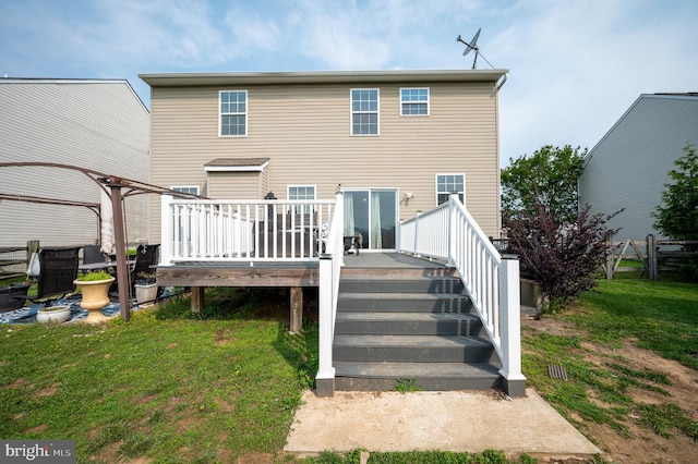 57 Pebble Creek Dr, Smyrna, DE 19977 - rear view of property with a wooden deck, a lawn, and stairway
