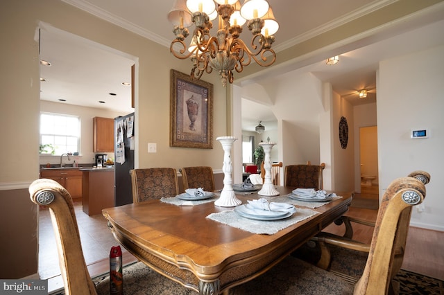57 Pebble Creek Dr, Smyrna, DE 19977 - dining area with a chandelier, crown molding, and baseboards