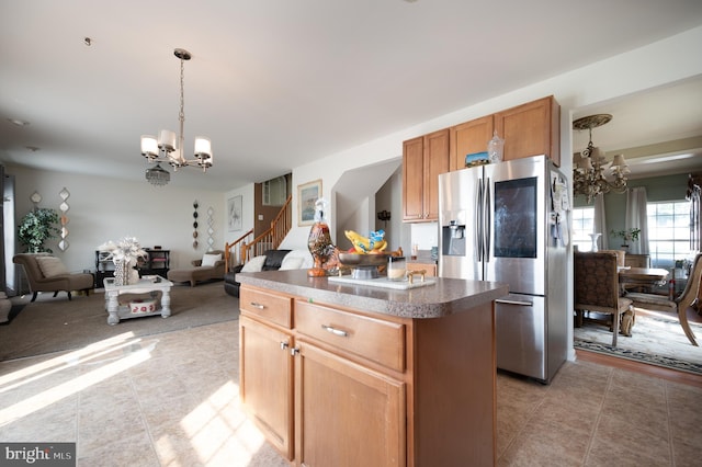 57 Pebble Creek Dr, Smyrna, DE 19977 - kitchen with a chandelier, stainless steel fridge, light tile patterned flooring, and a kitchen island