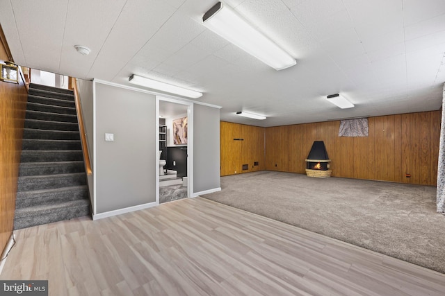 39 Riverview Ave, West Deptford, NJ 08086 - finished basement with stairs, light wood-style flooring, wood walls, and light carpet