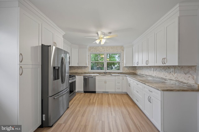 39 Riverview Ave, West Deptford, NJ 08086 - kitchen with stainless steel appliances, a sink, a ceiling fan, and white cabinets