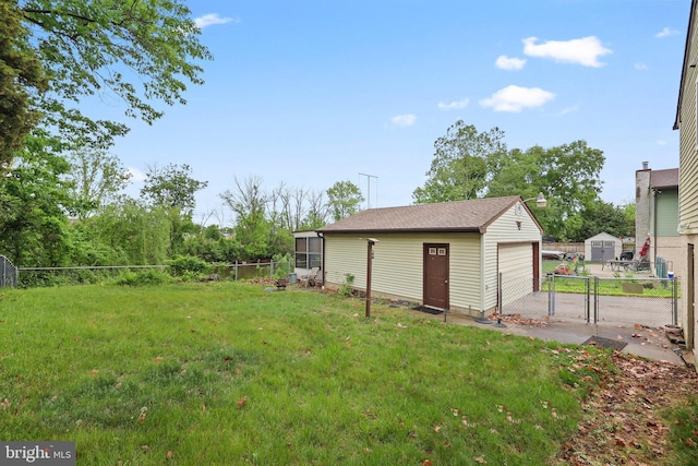 39 Riverview Ave, West Deptford, NJ 08086 - view of yard with an outbuilding, a garage, and a gate