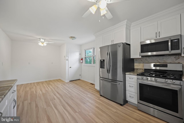 39 Riverview Ave, West Deptford, NJ 08086 - kitchen featuring stainless steel appliances, ceiling fan, white cabinets, decorative backsplash, and stone counters