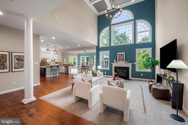 6354 Islington St, Middle River, MD 21220 - living area featuring decorative columns, light wood-style floors, healthy amount of natural light, recessed lighting, and a towering ceiling