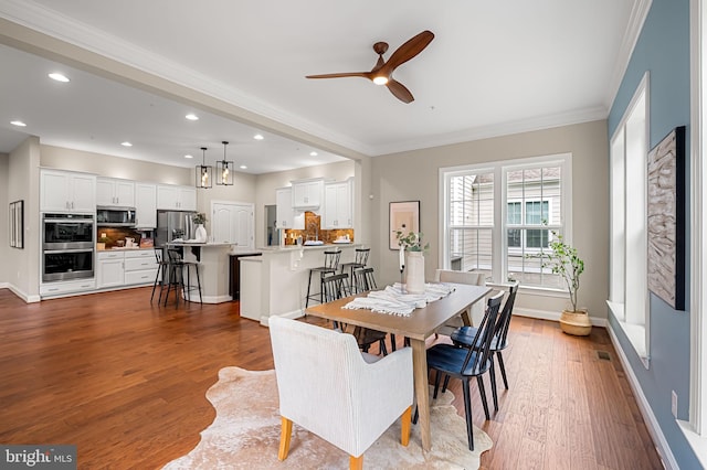 6354 Islington St, Middle River, MD 21220 - dining space featuring a ceiling fan, wood finished floors, baseboards, recessed lighting, and ornamental molding