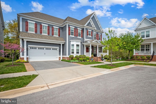 6354 Islington St, Middle River, MD 21220 - view of front of home with a garage, a shingled roof, a porch, and asphalt driveway