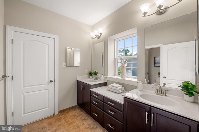 6354 Islington St, Middle River, MD 21220 - bathroom featuring toilet, double vanity, and baseboards