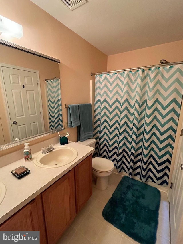 full bathroom with visible vents, vanity, tile patterned floors, toilet, and a shower with shower curtain