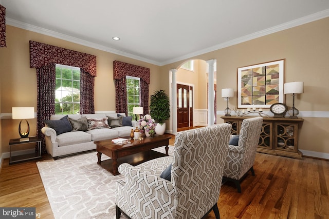 12850 Salmon Run Ct, Manassas, VA 20112 - living area featuring ornamental molding, arched walkways, ornate columns, and wood finished floors