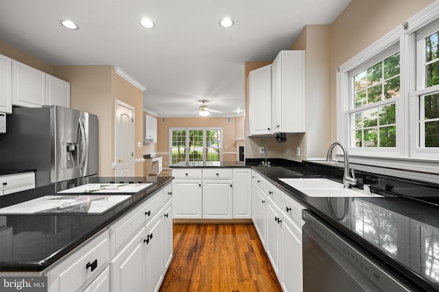 12850 Salmon Run Ct, Manassas, VA 20112 - kitchen with stainless steel appliances, white cabinets, recessed lighting, and a sink