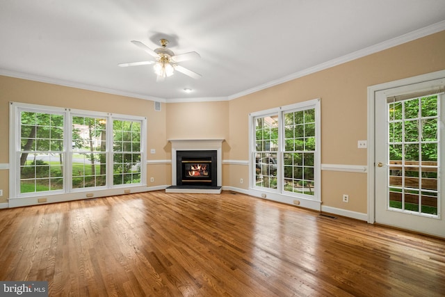 12850 Salmon Run Ct, Manassas, VA 20112 - unfurnished living room with a ceiling fan, baseboards, a glass covered fireplace, crown molding, and wood finished floors