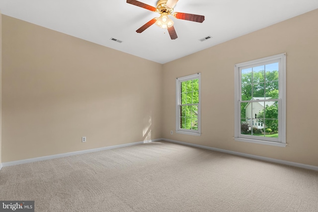 12850 Salmon Run Ct, Manassas, VA 20112 - unfurnished room featuring carpet, a wealth of natural light, and visible vents